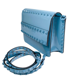 Side angle of Valentino Patent Crossbody Bag displaying compact crossbody shape and modern design