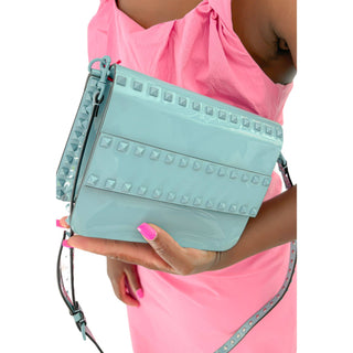 Valentino Patent Crossbody Bag worn by model, demonstrating size, strap length, and elegant crossbody styling