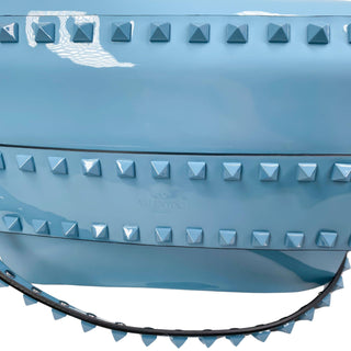 Close-up of Valentino Patent Crossbody Bag emphasizing smooth patent texture and elegant craftsmanship