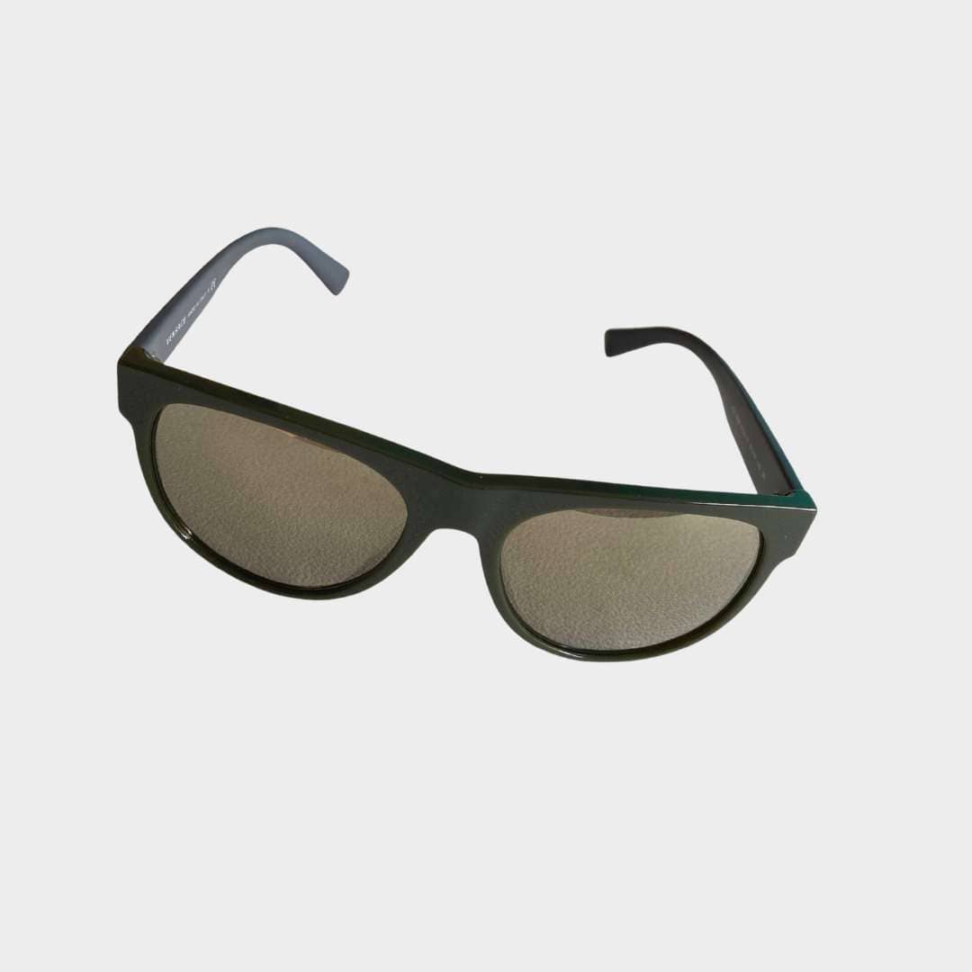 Front three-quarter view of luxury Versace sunglasses featuring a sleek gray rectangular frame and dark gradient lenses.