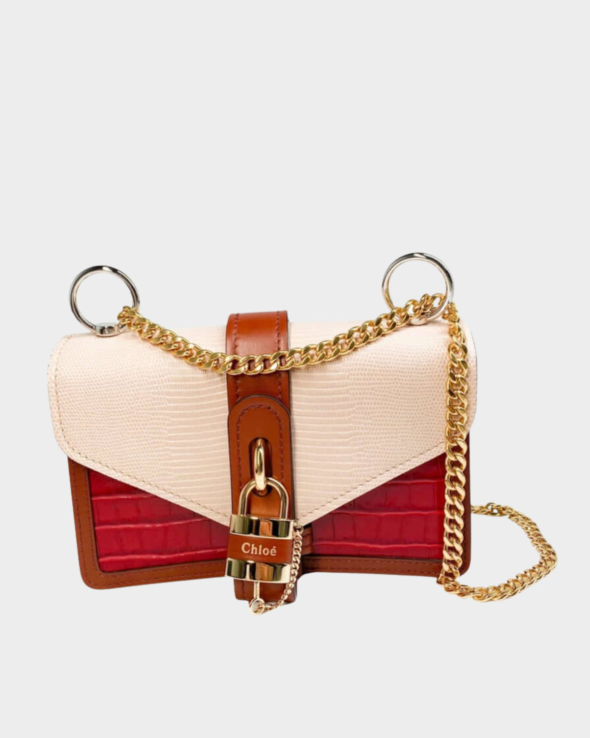 Front view of the Chloé Aby Day Chain bag in red croc-effect and pink lizard-effect leather, featuring its iconic signature padlock