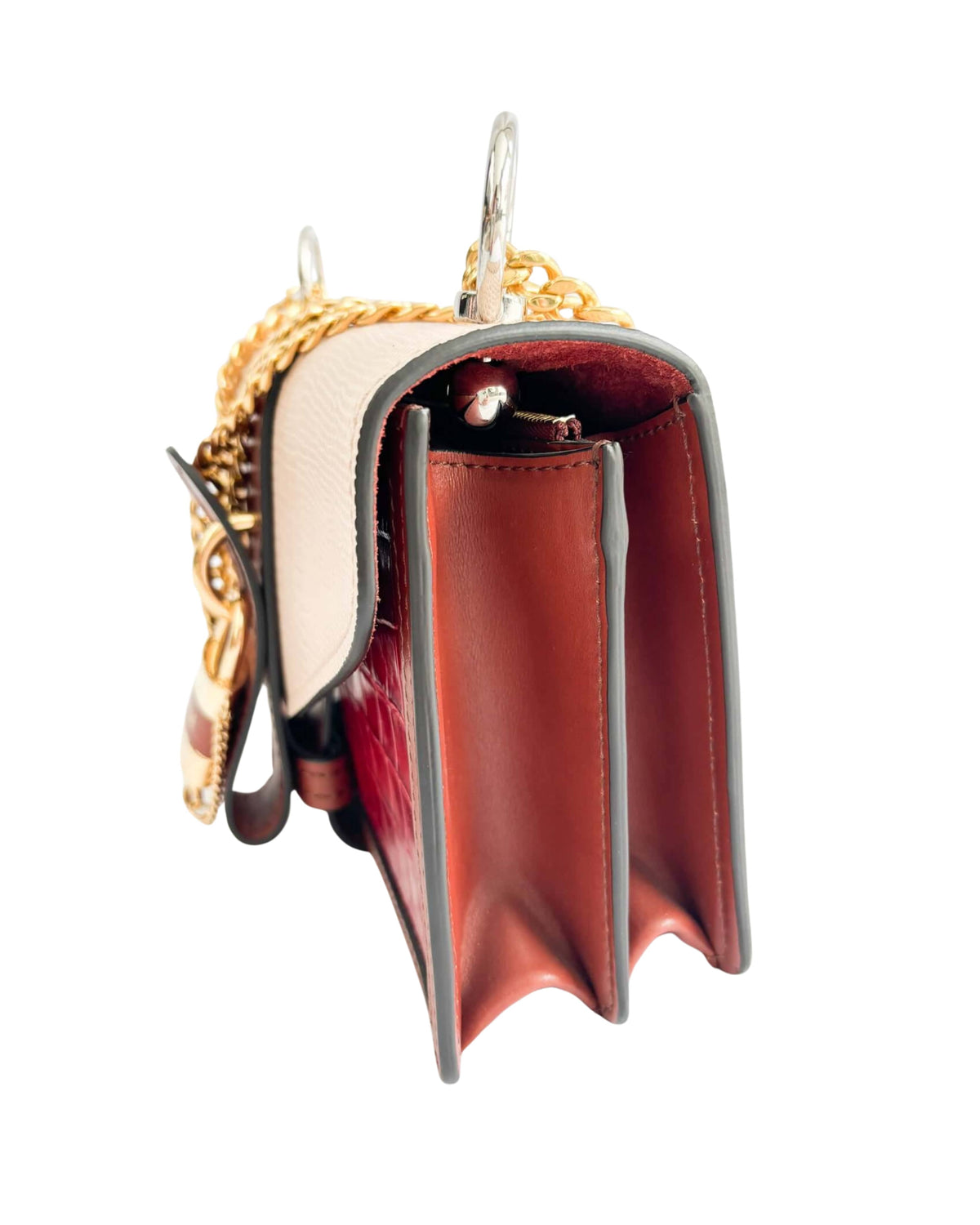 Side profile view of the Chloé Aby Day Chain bag, showcasing its structured silhouette and spacious accordion-style depth.