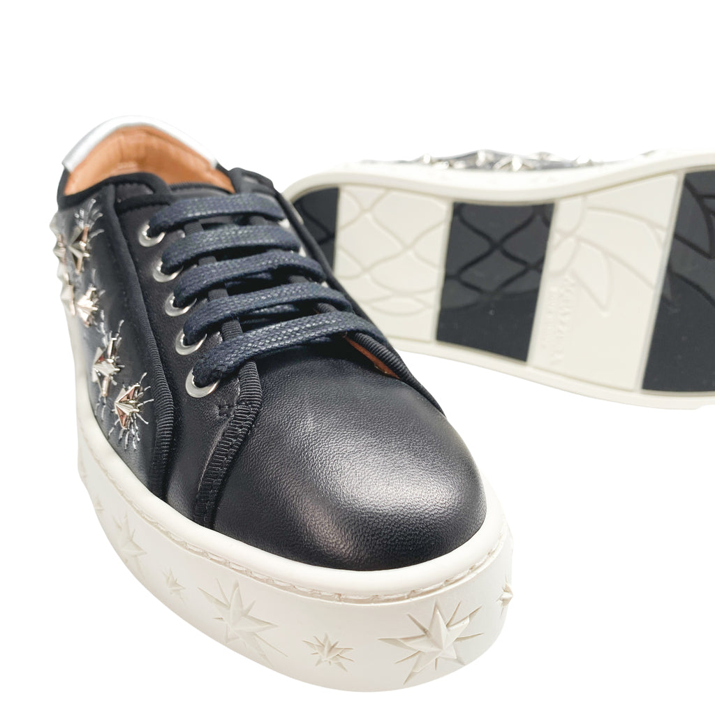 Aquazzura Cosmic Star Sneaker in black leather with star-detailed white platform sole.