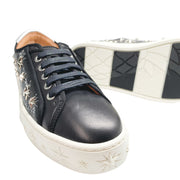 Aquazzura Cosmic Star Sneaker in black leather with star-detailed white platform sole.