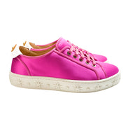 Right side view of Aquazzura LA low-top pink satin sneakers with a thick white sole featuring embossed star patterns.