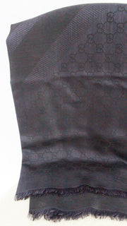 Side-by-side vertical fold view of Gucci navy blue GG monogram silk wool square shawl.