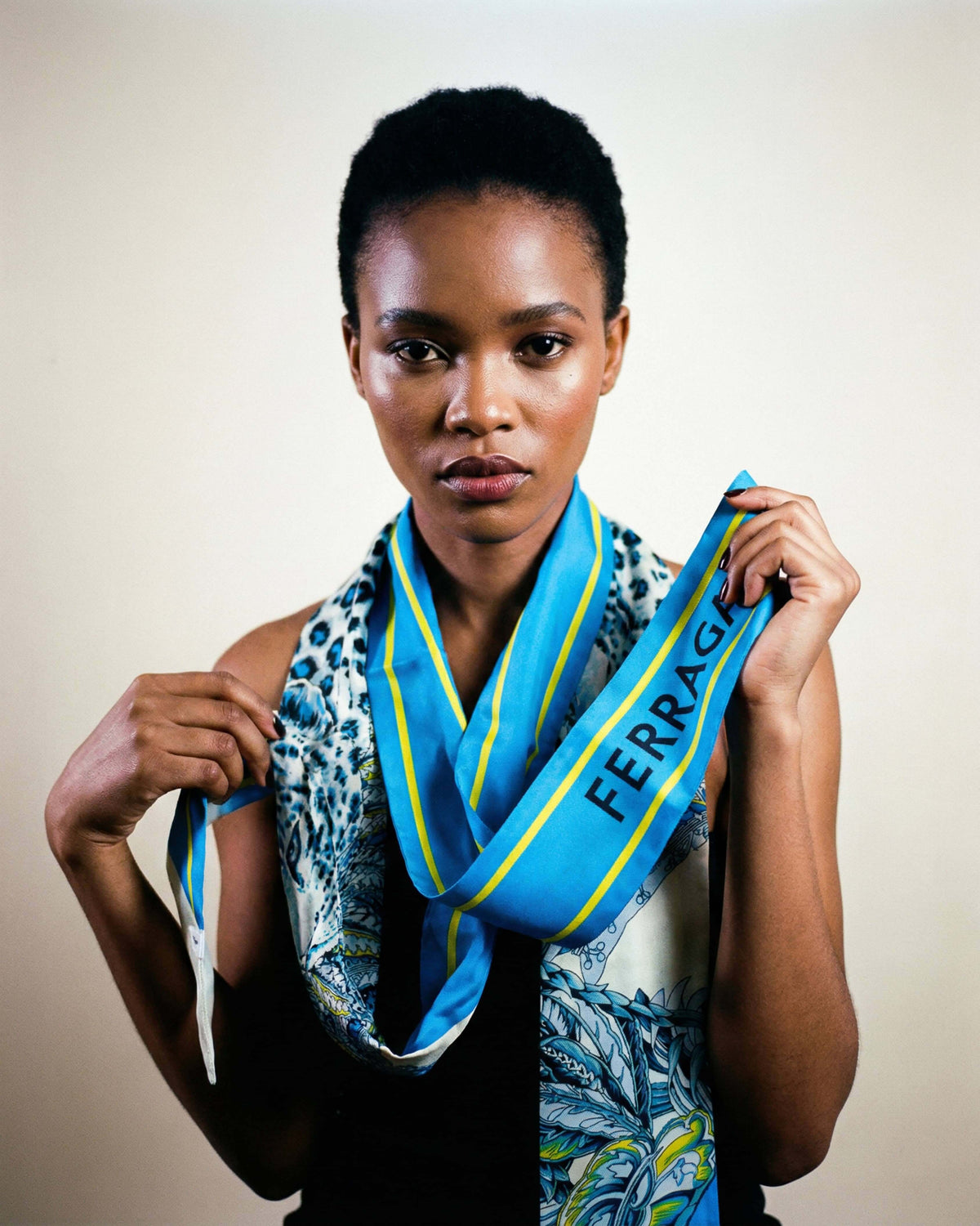 Ferragamo animal print silk bandeau styled on a model tied around the neck.