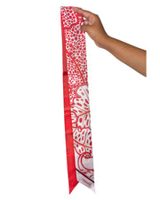 Full length vertical view of the red Salvatore Ferragamo foliage print silk scarf showing the tapered angled ends.