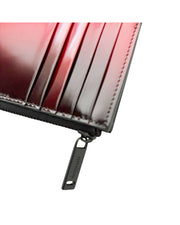 Ferragamo men's two-tone leather card holder featuring secure top zip fastening.