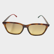 Front view of Gucci women's rectangular sunglasses in brown tortoise shell frame with warm tinted gradient lenses