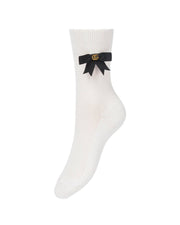 Close-up view of the white Gucci cotton sock showcasing the delicate black grosgrain bow and gold GG logo embellishment.