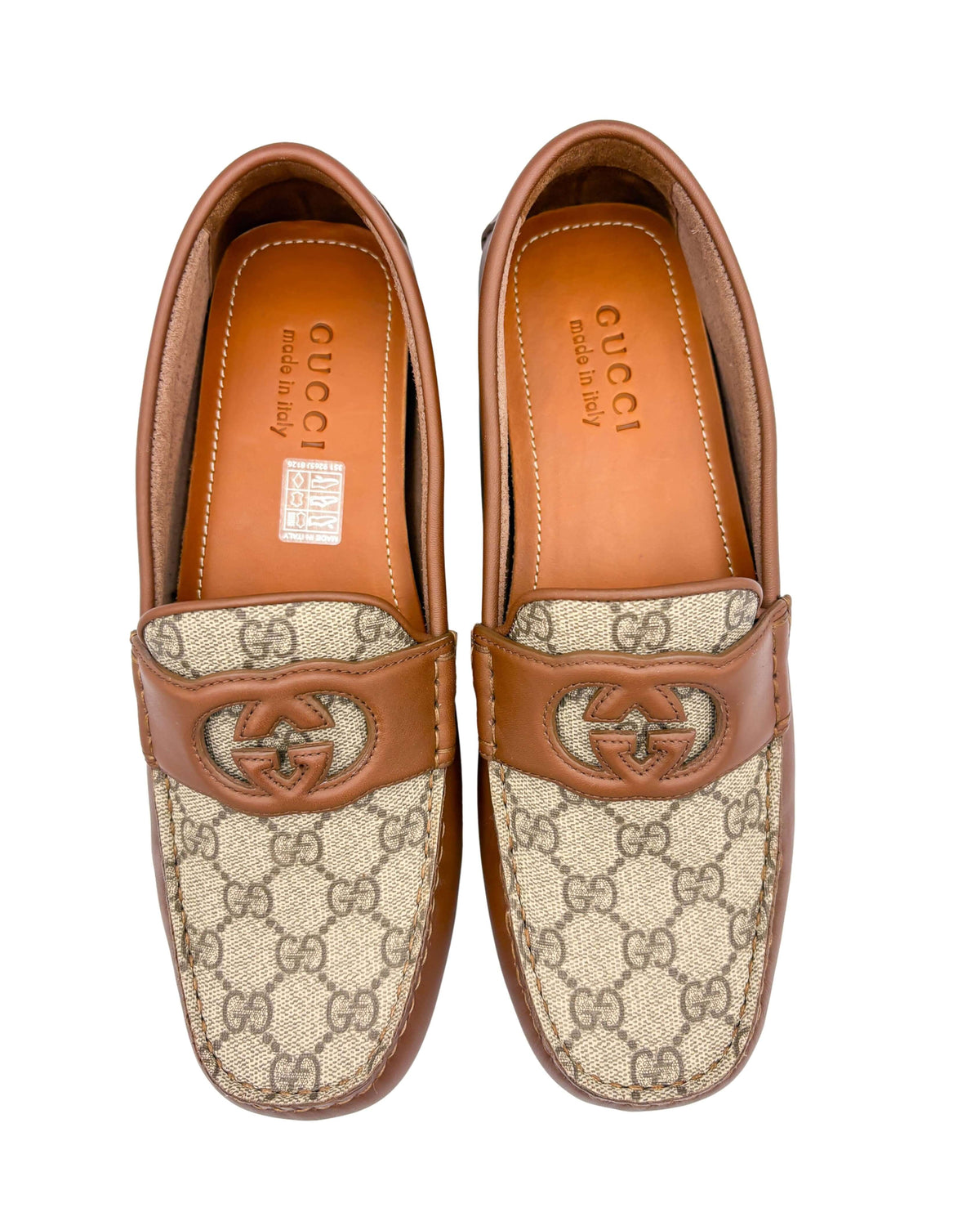 Overhead view of Gucci men's Clove brown leather and GG Supreme canvas driver loafers.
