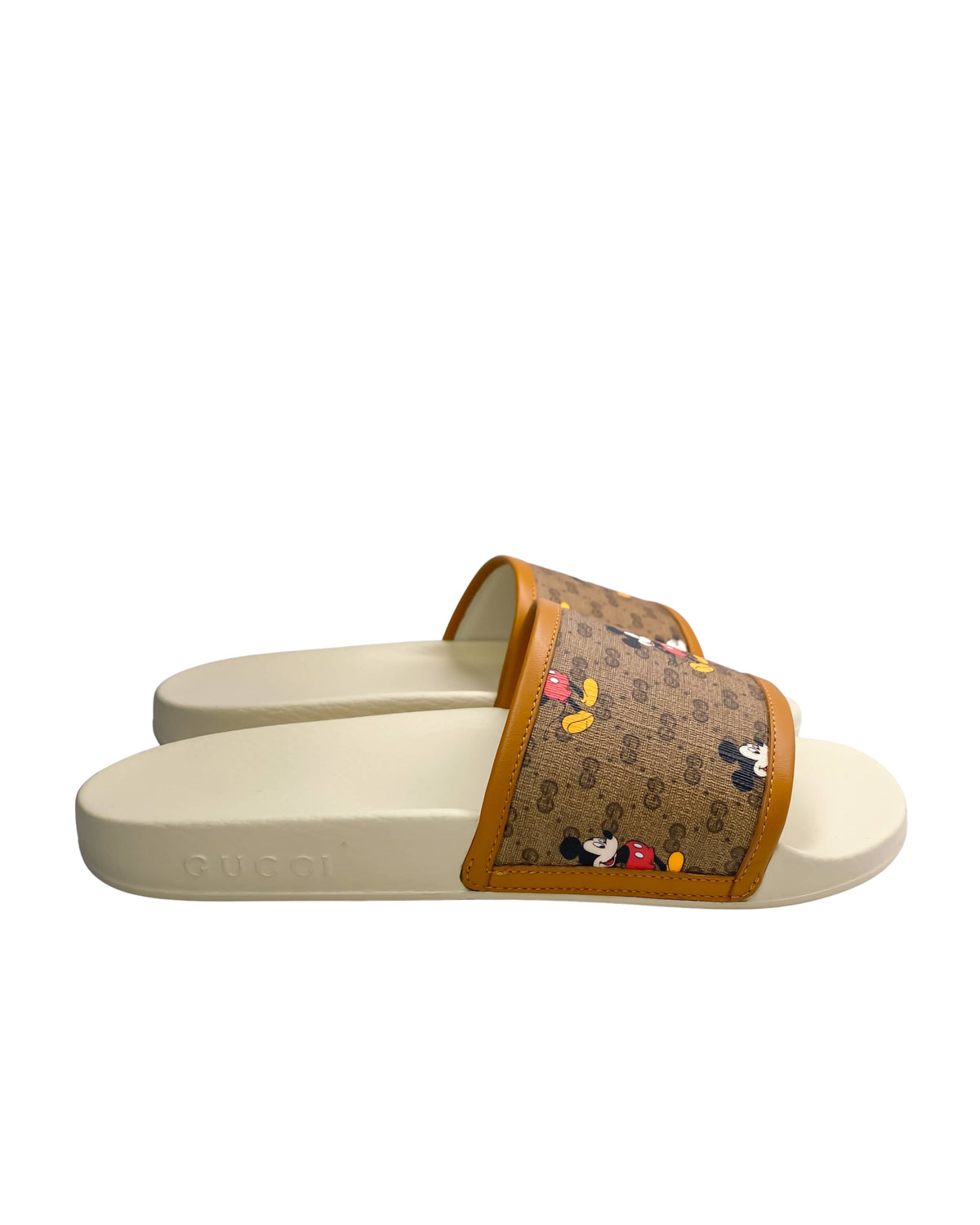 Side view of Gucci Mickey Mouse slides with iconic character print
