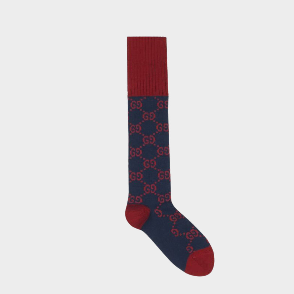 Single navy blue and red Gucci long sock featuring an all-over interlocking GG intarsia knit pattern.