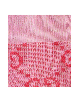 Close-up of Gucci lamé GG socks in pink showing GG monogram and shimmer texture