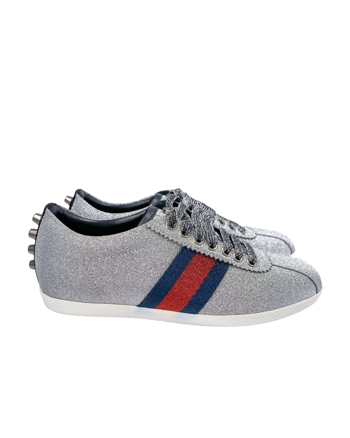 Side view of Gucci silver trainers with modern sneaker design