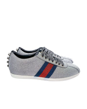 Side view of Gucci silver trainers with modern sneaker design