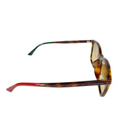 Angled side profile of Gucci rectangular sunglasses highlighting the brown tortoise acetate frame and temple arms