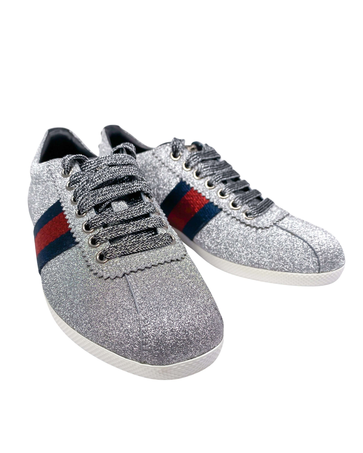 Close-up of Gucci trainers in silver highlighting premium craftsmanship