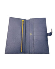 Open interior layout view of Hermès Bearn Soufflet wallet in Blue Indigo showing organized credit card slots, bill compartments, and zippered coin purse.