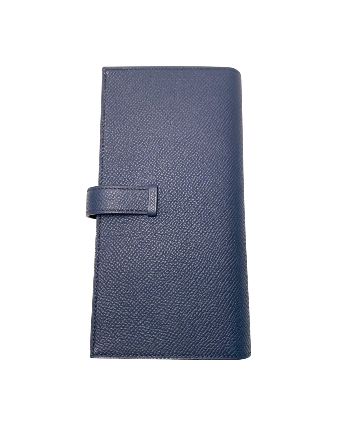 Rear view of Hermès Bearn Soufflet wallet in Blue Indigo displaying fine leather grain, precise edge stitching, and clean minimalist silhouette.
