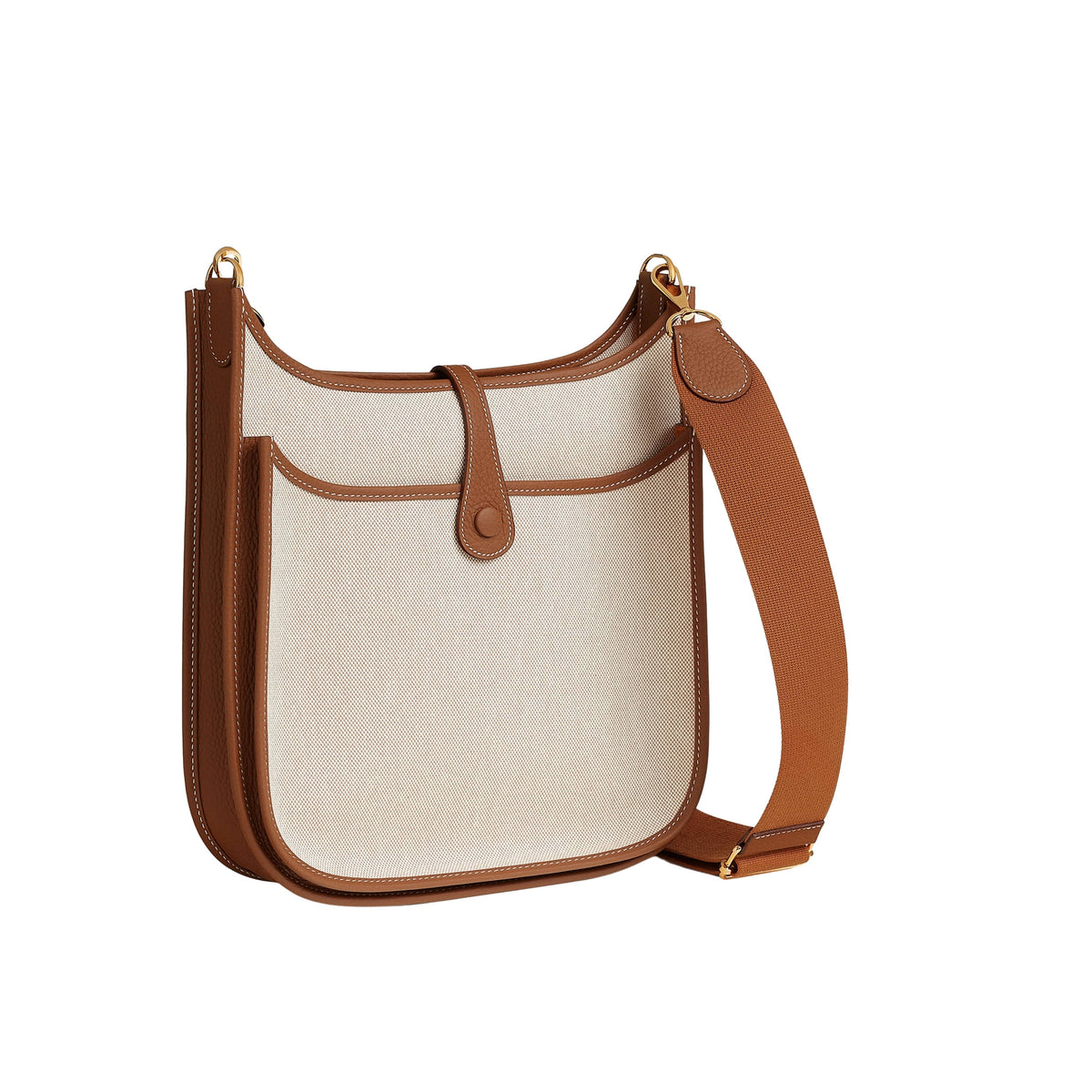 Rear view of Hermès Evelyne III 29 bag in Écru canvas showing the functional exterior slip pocket and Gold leather trim.
