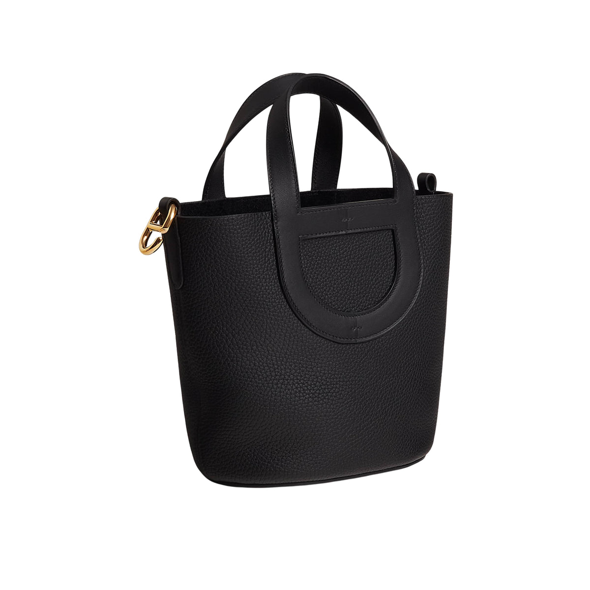 Side profile view of Hermès In-the-Loop 18 black leather bucket bag displaying its structured silhouette and soft leather grain.