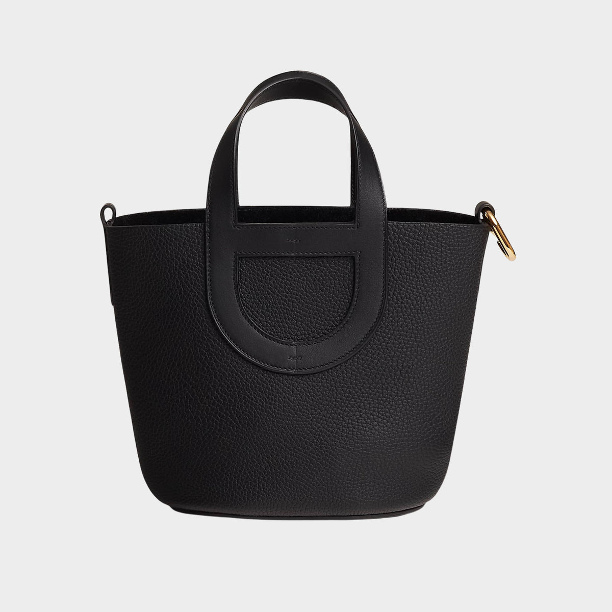 Hermès In-the-Loop 18 handbag in black Clemence leather featuring gold-tone Chaîne d'Ancre top handles and structured bucket shape.