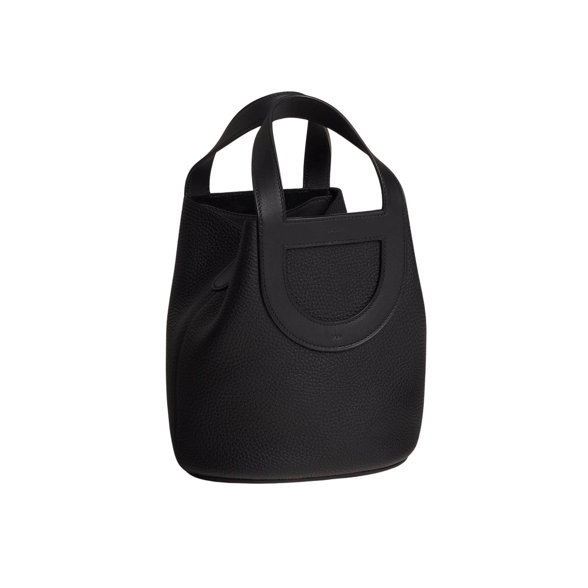 Direct front view of Hermès In-the-Loop 18 black Clemence leather bucket bag showing dual top handles and contrast leather piping.
