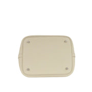 Bottom base view of Hermès Picotin Lock 22 in Beton grey leather showing four protective metal purse feet studs.