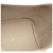Open interior view of Hermès Picotin Lock 22 in Beton displaying spacious main compartment and raw suede interior lining.