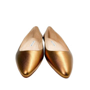 Top-down view of the Manolo Blahnik gold leather BB flats highlighting the elegant pointed toe structure.