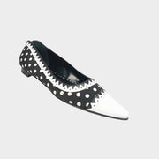 Manolo Blahnik Elaphiria black and white polka dot ballet flats with a white pointed cap toe.