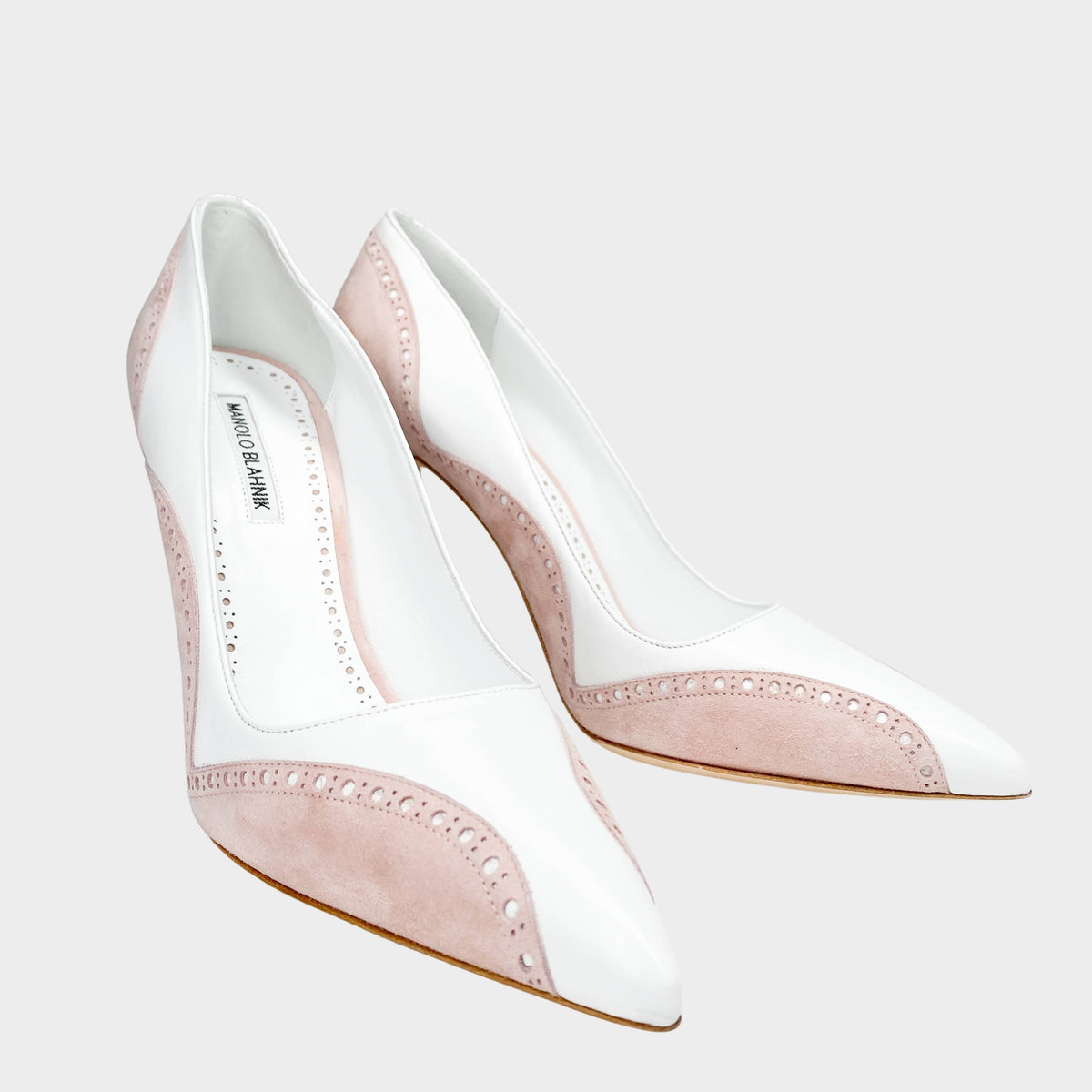 Manolo Blahnik Minisia 105 white pumps featuring a crystal jeweled buckle and an elegant pointed toe profile, luxury designer high heels buy in South Africa