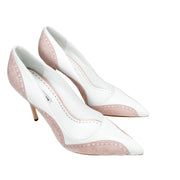 Top-down studio view of the Manolo Blahnik Minisia white pumps showcasing the beige leather lining and interior branding.