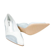 Side angle view showcasing the natural leather outsole, pointed toe silhouette, and light blue lace trim on the Manolo Blahnik Minisia 70 pump.