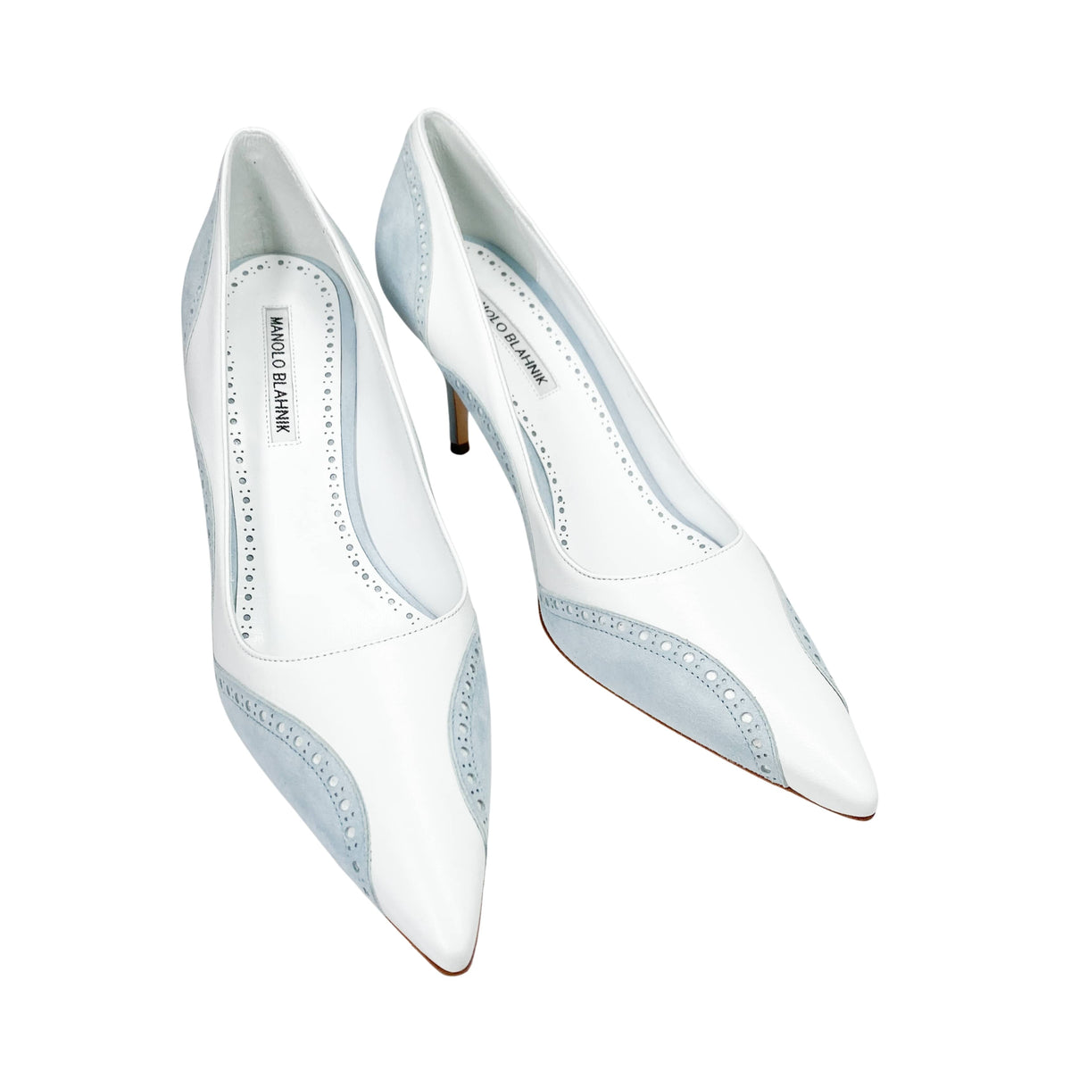 Overhead front view of a pair of Manolo Blahnik Minisia 70 white and light blue lace-overlay pumps displaying the sleek pointed toe box.