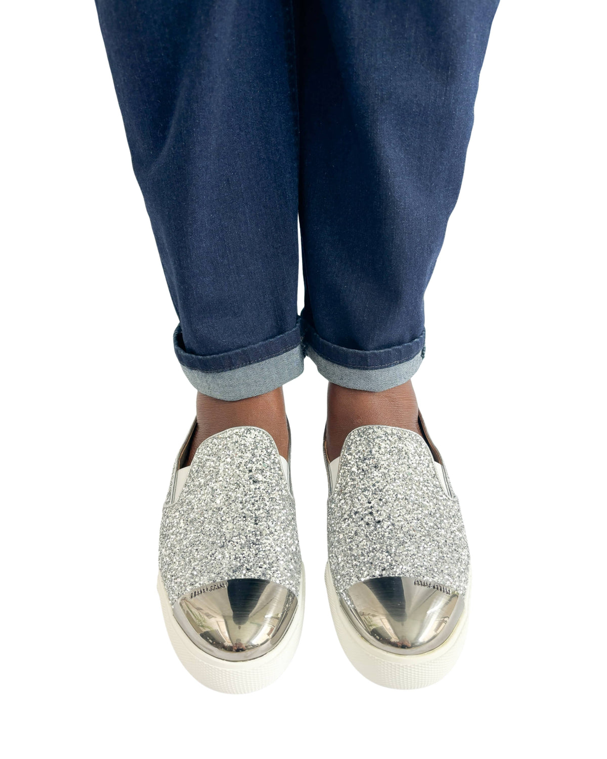 Miu Miu round toe silver sparkle slip-on sneakers styled on foot
