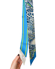 Ferragamo silk bandeau scarf with bold cheetahs design showcasing fabric detail and brand signature.