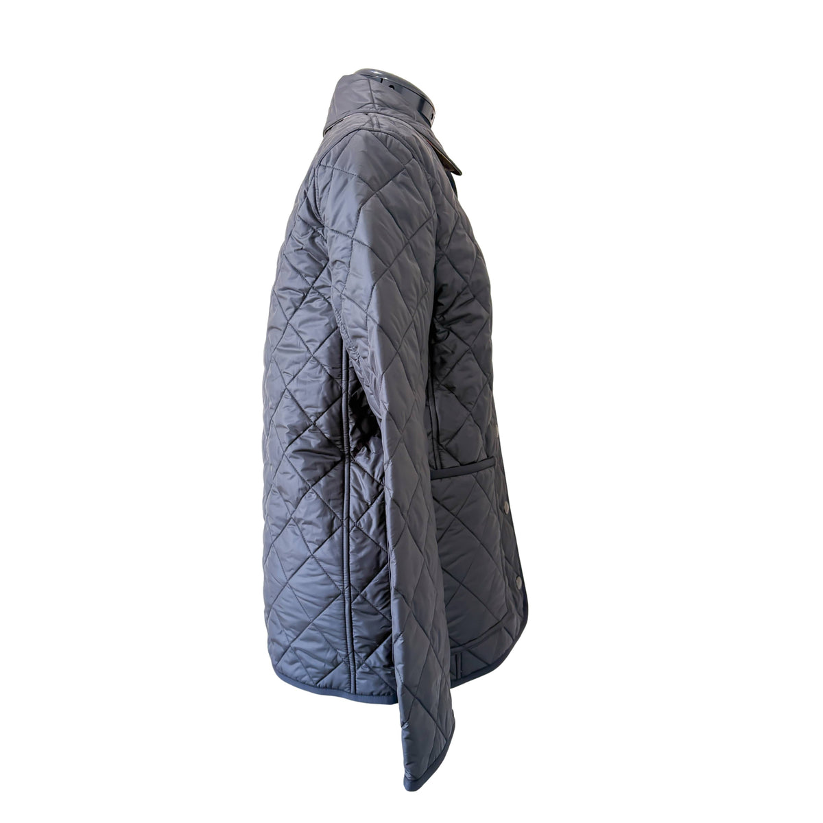 Side profile view of the Burberry Dalry black quilted jacket, demonstrating its sleek profile and lightweight fit.