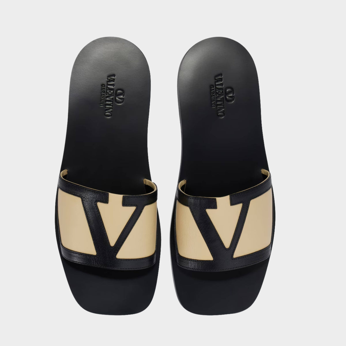 Valentino Garavani VLogo two-tone leather slides in black and beige