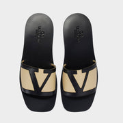 Valentino Garavani VLogo two-tone leather slides in black and beige