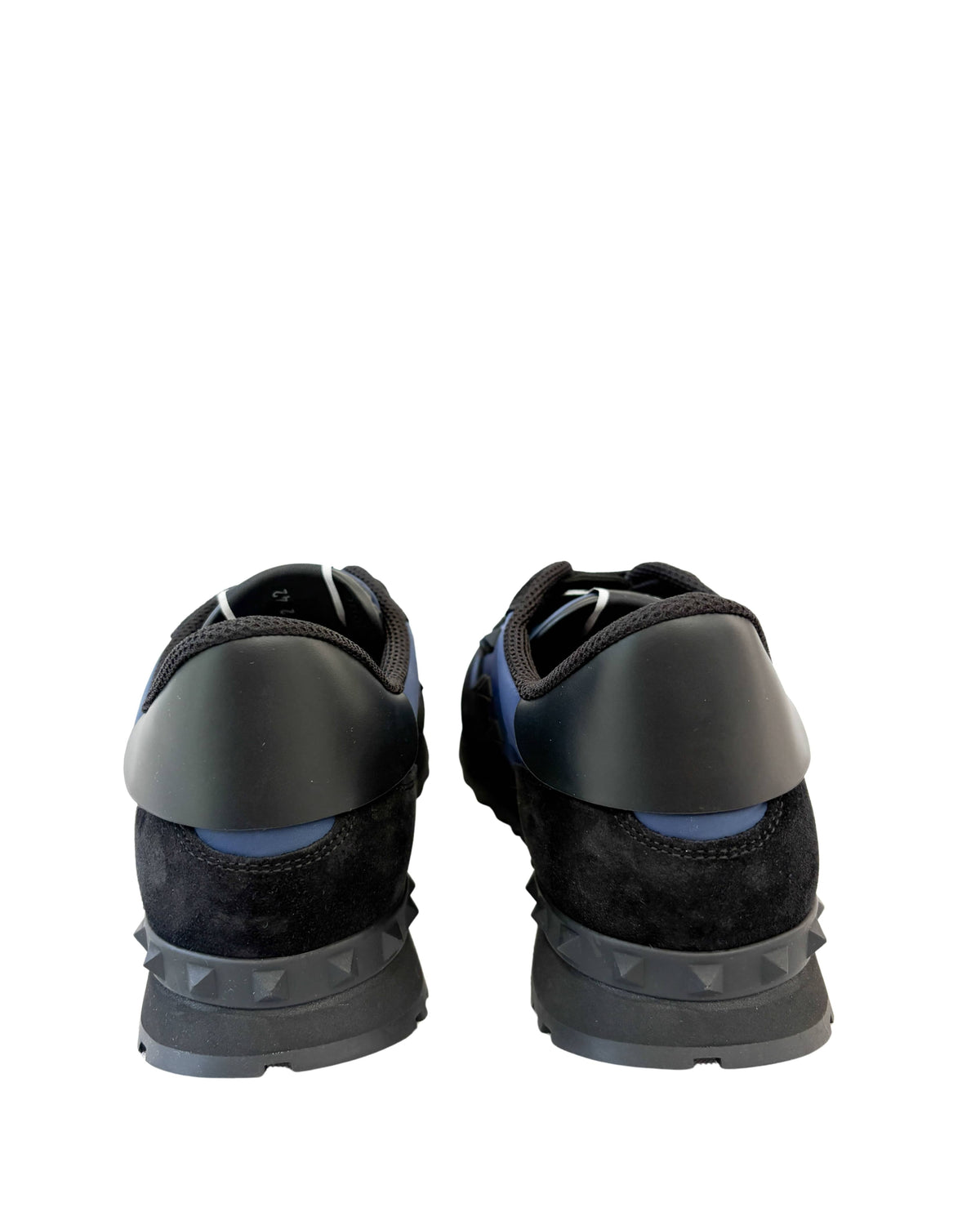 Back view of navy Valentino Rockrunner sneakers showing black heel counters and studded rubber clips.