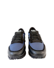 Front view of a pair of navy blue Valentino Rockrunner sneakers displaying black toe caps and laces.