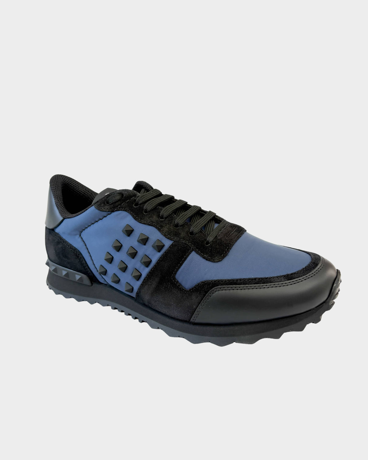 Valentino Rockrunner Leather Suede and Shell Sneaker in navy and black with signature heel studs.