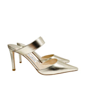 Side profile view showcasing the sleek silhouette and 85mm stiletto heel height of the gold Jimmy Choo Cheri pump.