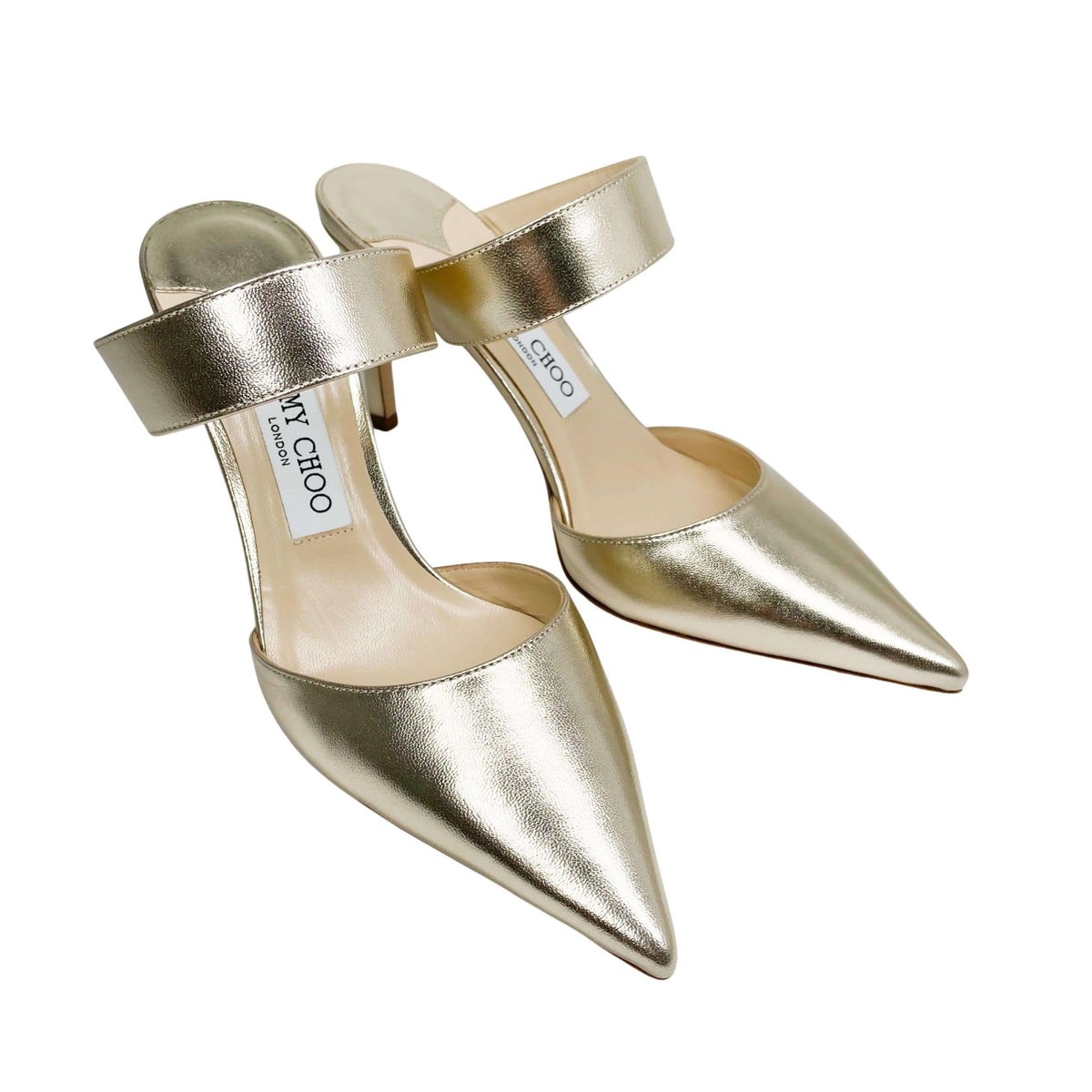 Three-quarter studio view of a pair of Jimmy Choo Cheri 85 metallic gold evening heels.